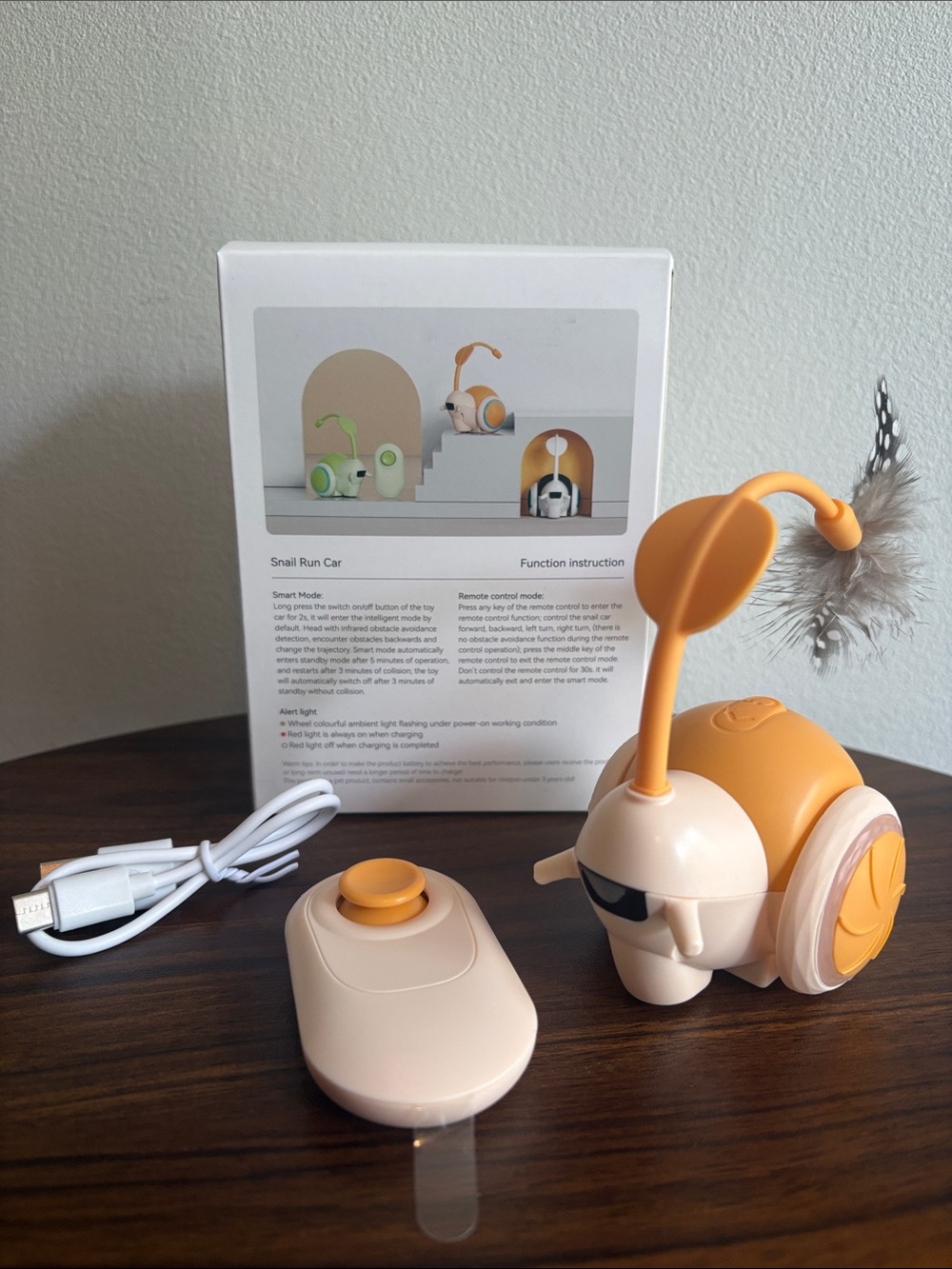 Rechargeable Orange Snail Cat Toy with Feather Teaser and Remote